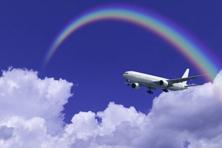 Passenger plane and clouds and the Rainbowの写真素材