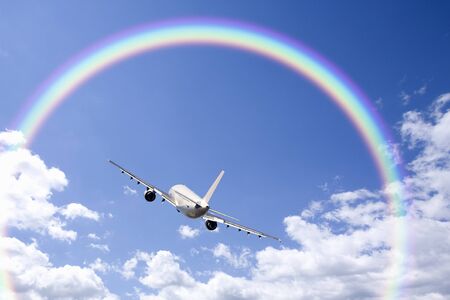 Passenger plane and clouds and the Rainbow