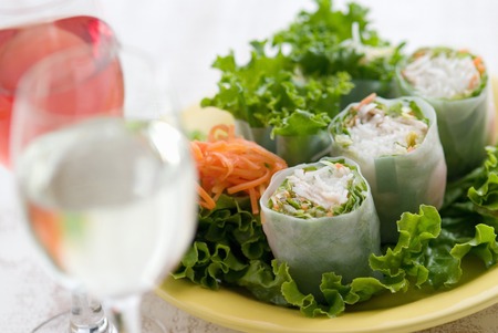 Wine and raw spring rollsの写真素材