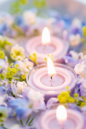 Aroma candle and blue flowersの写真素材