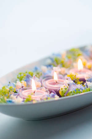 Aroma candle and blue flowersの写真素材
