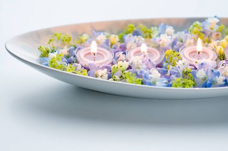 Aroma candle and blue flowersの写真素材