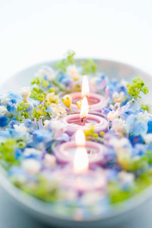 Aroma candle and blue flowersの写真素材