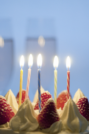 Birthday cake and candle flameの写真素材