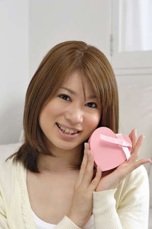 Women with heart boxの写真素材