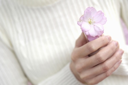 Woman with a flowerの写真素材
