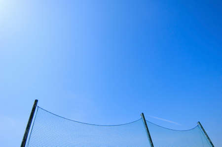 Blue sky and backstopの写真素材