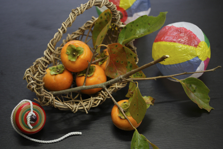 Persimmon and Japanese toysの写真素材