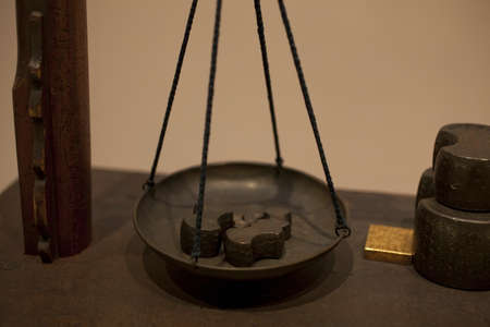 Dish and the weight of the balanceの写真素材