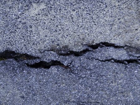 Cracks in the asphalt road