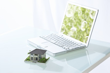 Model of laptop and homeの写真素材