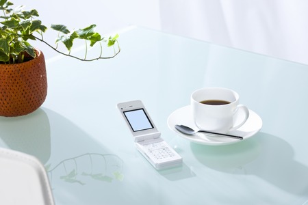 Coffee and cell phoneの写真素材