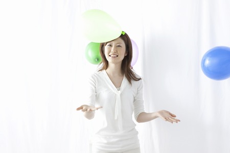Girls playing with balloonsの写真素材