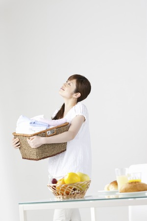 Washer woman with a basket.の写真素材