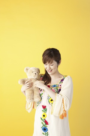 Woman playing with toyの写真素材