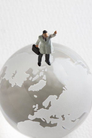 Globe and businessman miniatureの写真素材