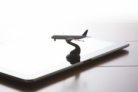 Tablet PC and the planeの写真素材