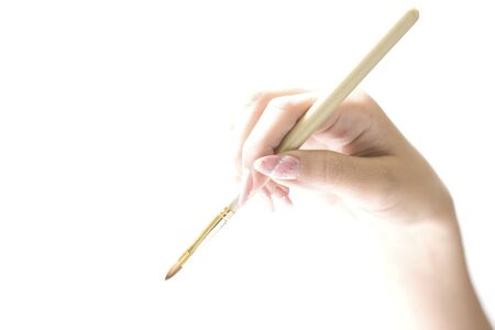 Woman with a makeup brushの写真素材