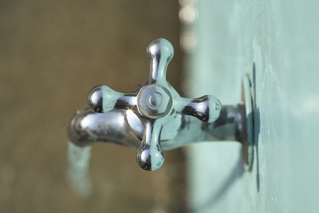 Faucet and tap waterの写真素材