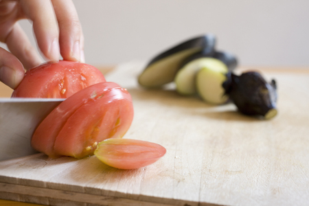Tomato and eggplant and kitchen knifeの写真素材