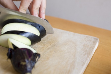 Eggplant and kitchen knifeの写真素材