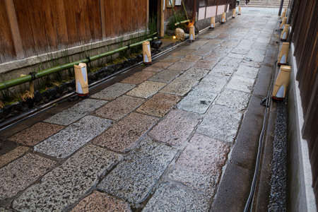 Cobbled stone fence alleyの写真素材