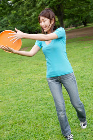 Woman to the flying diskの写真素材
