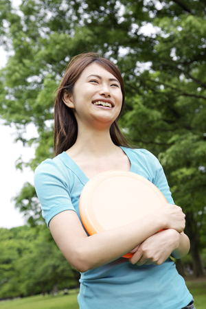 Women with flying diskの写真素材