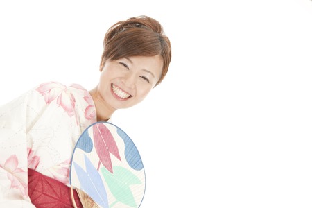 Yukata woman with fanの写真素材