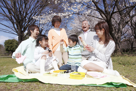 Three generation family that surrounds your lunchの写真素材