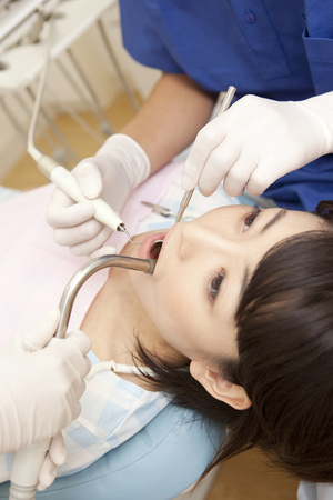 Female patients undergoing dental treatmentの写真素材