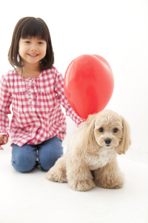 Heart of balloons and Marupu and girlsの写真素材