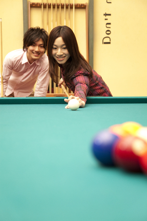 Men who stare the woman hit the break shotの写真素材