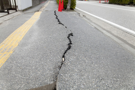 Sidewalk that was raised in the liquefaction phenomenonの写真素材