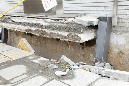 Elevator that was raised in the liquefaction phenomenonの写真素材