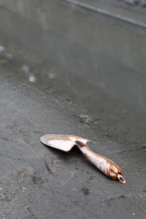 Scoop of remains was placed with puddleの写真素材