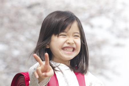 Girl to the peace signの写真素材