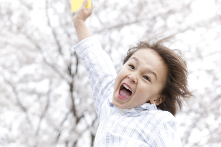 Boy to issue a yellow cardの写真素材