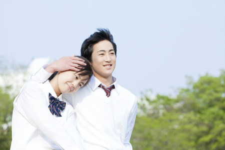 High school student couple cuddleの写真素材