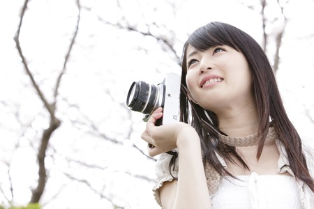 Bring a camera, smiling womanの写真素材