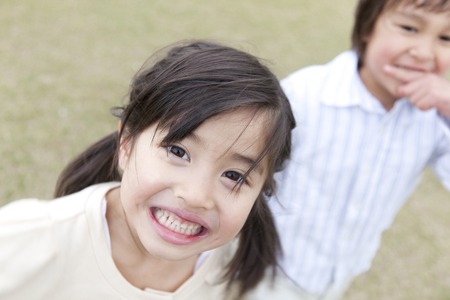 Children running the squareの写真素材