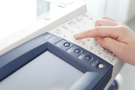 Hand of OL to take a copyの写真素材