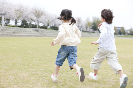 Children running the squareの写真素材