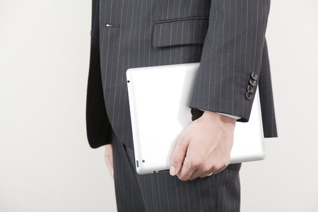 Hand of businessman with a tablet PCの写真素材
