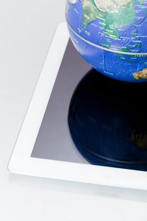 Tablet PC and the globeの写真素材
