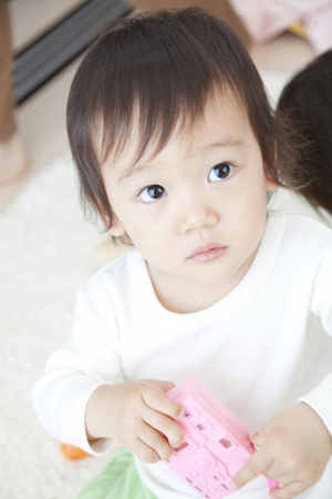 Boy with a toyの写真素材
