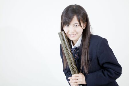 High school girls to smile with a diplomaの写真素材