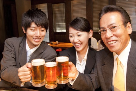 Businessman for a toast with beerの写真素材