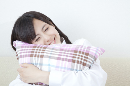 Cushion with a smiling female high school studentsの写真素材