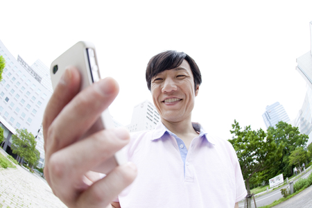 Businessman with a Smartphoneの写真素材